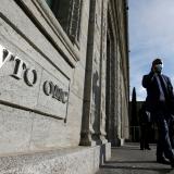 A delegate arrives before a meeting at the World Trade Organization in Geneva, Switzerland on October 28, 2020.