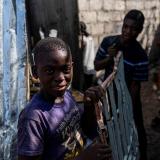 Boys working at a metal recycler carry metal scavenged from houses destroyed in a 7.2 magnitude earthquake in Les Cayes, Haiti, on August 14, 2021. Photo taken on August 21, 2021.