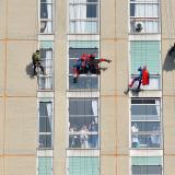 Acrobats dressed as superheroes greeted children outside their windows in the pediatric ward of the San Paolo Hospital in Milan, Italy.