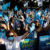 Women take part in a protest, organized by the "Women Wage Peace" grassroots movement, against Israel's planned annexation of part of the Israeli-occupied West Bank, outside government offices in Tel Aviv, Israel, on June 18, 2020