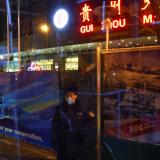 A security guard stands at the entrance of a media hotel inside a closed loop area designed to prevent the spread of the coronavirus disease (COVID-19) ahead of the Beijing 2022 Winter Olympics in Beijing, China January 26, 2022.