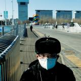 A security personnel stands guard at a closed loop bubble area, ahead of Beijing 2022 Winter Olympics, in Beijing, China, February 1, 2022. 