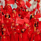 Athletes of China wave Chinese flags during the opening ceremony.