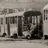 Black and white photo of shelled trams on Obala Kulina bana street