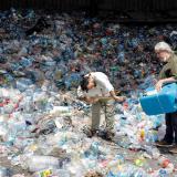 members of the ethnic instrumental music band Fungistanbul, perform with instruments made out of materials collected from landfills, at a recycling depot in Istanbul