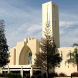 The Loma Linda University church, a white contemporary building, is seen against a blue sky