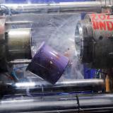 a purple plastic bucket tumbles as its being cooled at a factory line in Dakar, Senegal