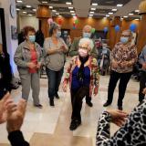 Eighty-three-year-old Rachel Gershom and other senior citizens dance at a vaccination party before they receive a fourth dose of the COVID-19 vaccine after Israel approved a second booster shot for the immunocompromised, people over sixty years, and medical staff, in a retirement home, in Netanya, Israel, on January 5, 2022.