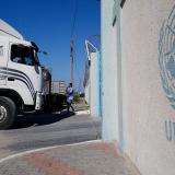 A UN Truck waits at an entrance with UNRWA label