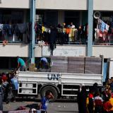 A UN aid truck is seen distributing aid to Palestinians