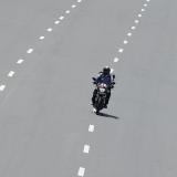 Delivery worker Devender Singh, who works for Licious, an online meat store, rides his bike on a deserted road, in New Delhi, India, on April 6, 2020.