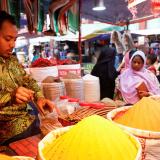 A shopkeeper sells powdered spices at Kawran Bazar, in Dhaka, Bangladesh, on May 22, 2022.