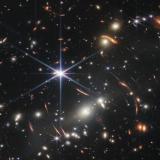 Thousands of galaxies flood this near-infrared image of galaxy cluster SMACS 0723. High-resolution imaging from NASA’s James Webb Space Telescope combined with a natural effect known as gravitational lensing made this finely detailed image possible. 