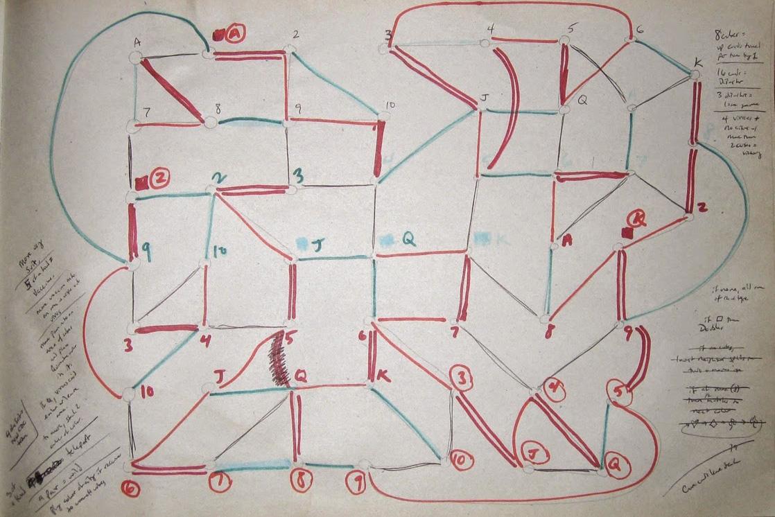 Photo shows a yellowed piece of paper heavily worked with pencil, pen, and blue and red marker. The paper has a rough sketch with numbers and letter connected by marker. 