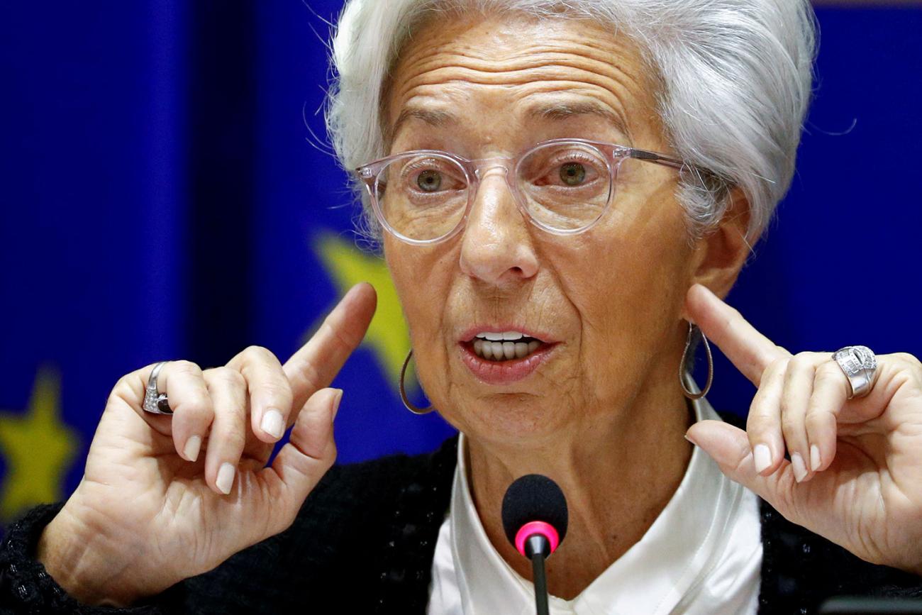 The photo shows the central banker at a microphone speaking and gesturing with her hands. 