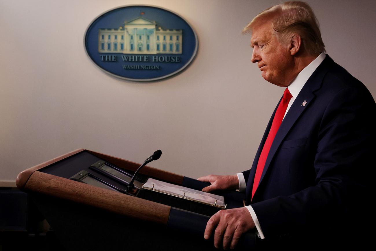 The photo shows the president at a podium taken from the side. 