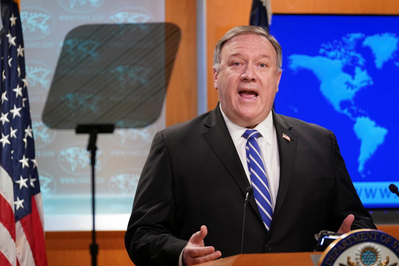 The photo shows Secretary Pompeo at a podium speaking. 