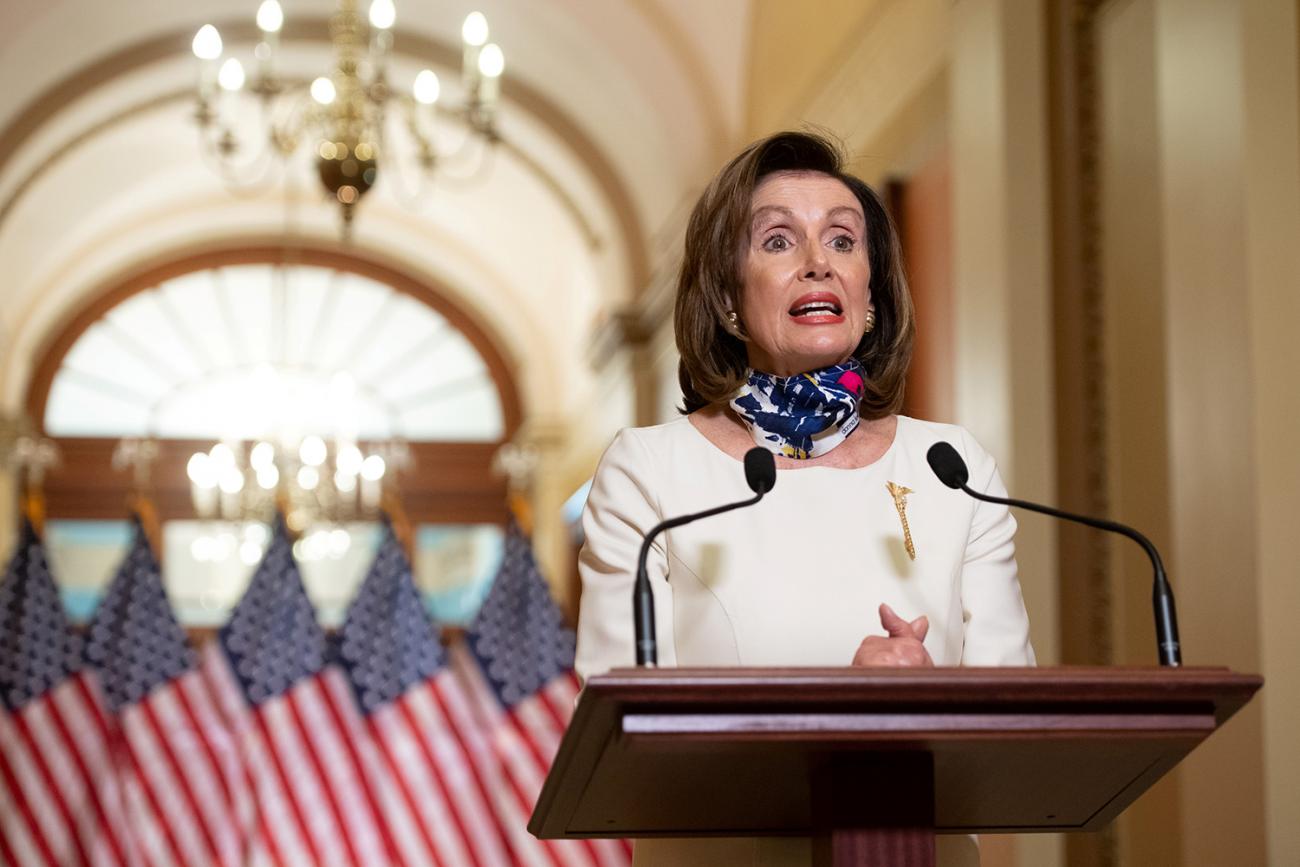 U.S. House Speaker Nancy Pelosi (D-CA) speaks about the 'Heroes Act', a proposal for the next phase of the coronavirus disease (COVID-19) relief legislation, in Washington, DC, on May 12, 2020. The photo shows the speaker at a podium standing in front of American flags speaking. 