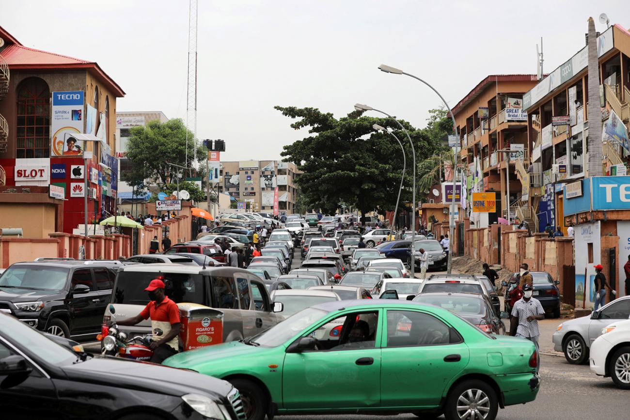 The photo shows a busy street locked in congestion of cars and traffic. 