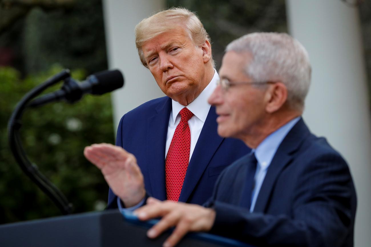 NIH National Institute of Allergy and Infectious Diseases Director Anthony Fauci speaks as U.S. President Donald Trump listens during a news conference in the Rose Garden of the White House in Washington, U.S., March 29, 2020.