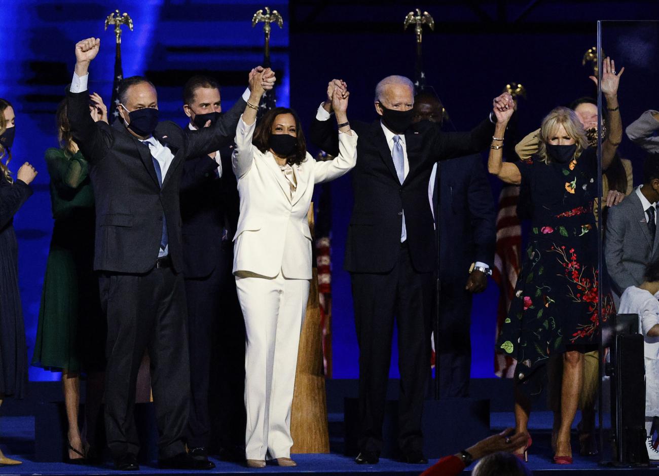 Democratic 2020 U.S. presidential nominee Joe Biden and his wife Jill, and vice presidential nominee Kamala Harris and her husband Doug, celebrate onstage at his election rally, after the news media announced that Biden has won the 2020 U.S. presidential election over President Donald Trump, in Wilmington, Delaware