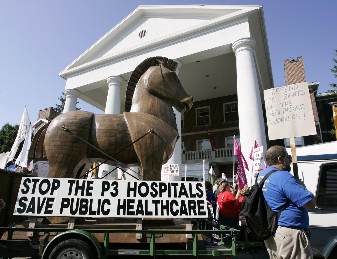 Using a Trojan Horse as a symbol of their cause, health care demonstrators gather outside the site where Provincial Premiers are meeting in Niagara-on-the-Lake, July 28, 2004. The premiers' meeting will highlight on health care prior to their meeting with the Prime Minister in the fall. 