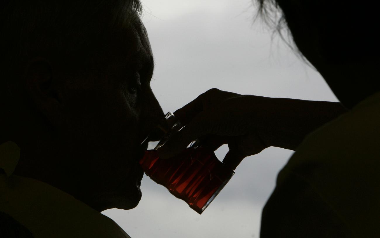 A care nurse helps a pensioner during lunch in a residential home for the elderly in Emmenbruecke near Lucerne December 7, 2007.