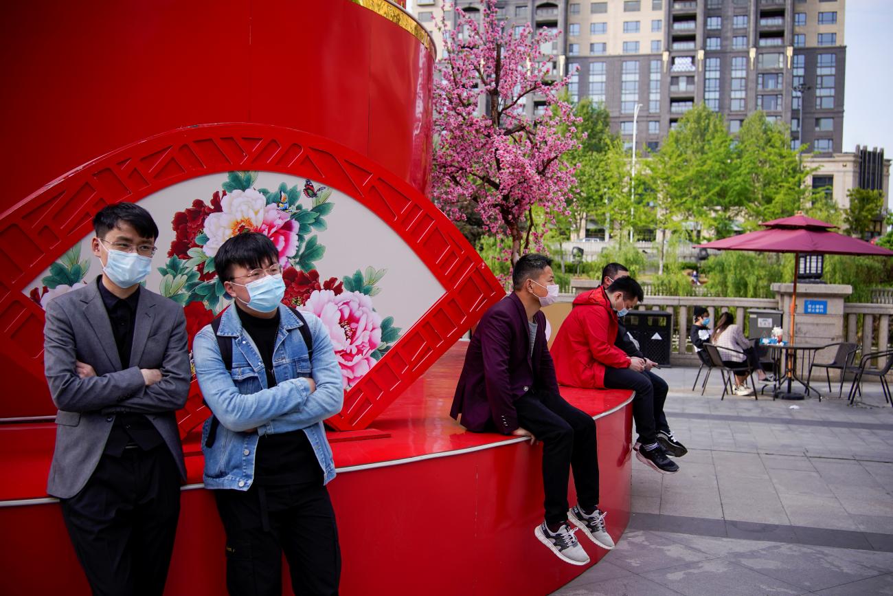 People wearing face masks are seen at a main shopping area after the lockdown was lifted in Wuhan, capital of Hubei province and China's epicentre of the novel coronavirus disease (COVID-19) outbreak, April 14, 2020