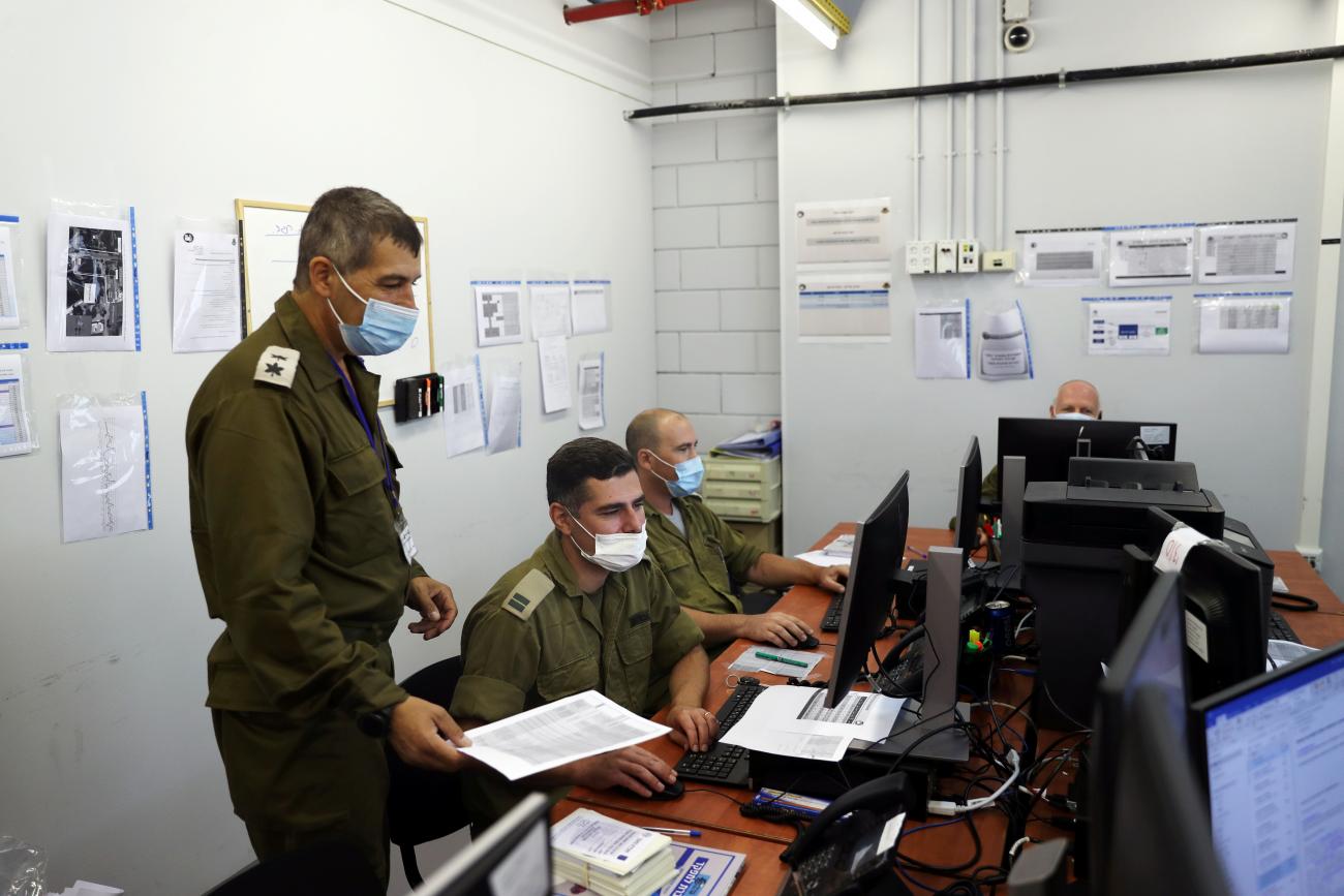 Israeli military personnel work at the Israeli Defence Force (IDF) Corona Task Force Headquarters as they conduct epidemiological investigations as part of the army's effort to trace chains of infection to curb the spread of the coronavirus disease (COVID-19), a day before a nationwide lockdown begins, in Ramle, Israel on September 17, 2020.