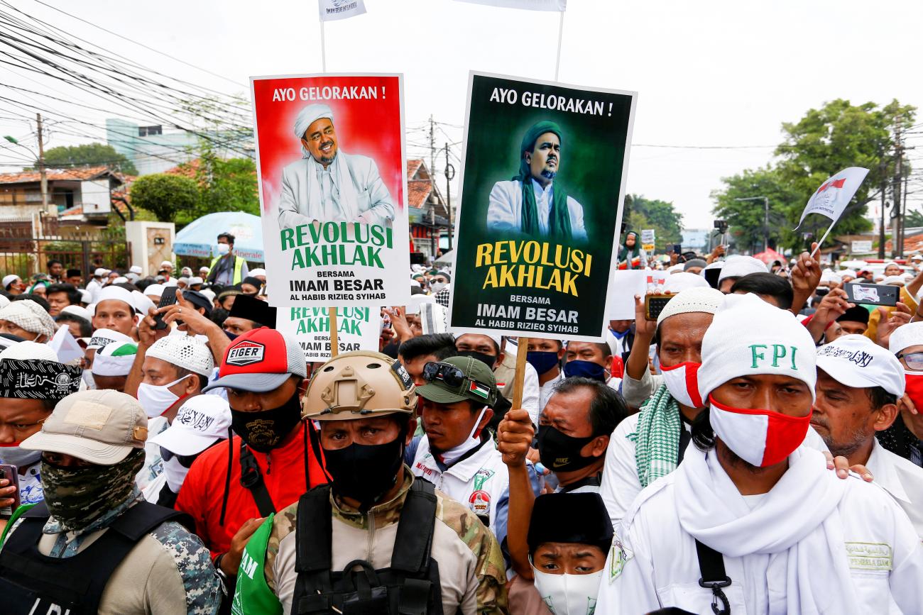 People gather for the homecoming of Rizieq Shihab, the leader of Indonesian Islamic Defenders Front (FPI) who has resided in Saudi Arabia since 2017 in Jakarta, Indonesia, November 10, 2020. 