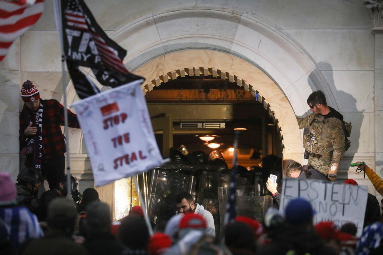 Police officers stand guard as supporters of President Donald Trump gather in front of the U.S. Capitol Building in Washington, DC on January 6, 2021.