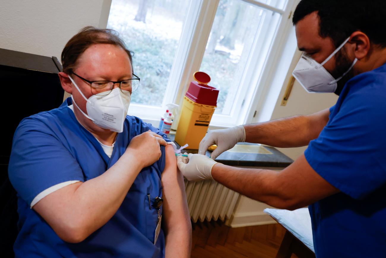 A doctor receives the Pfizer-BioNTech coronavirus disease vaccine at Havelhoehe community hospital in Berlin, Germany on January 14, 2021.