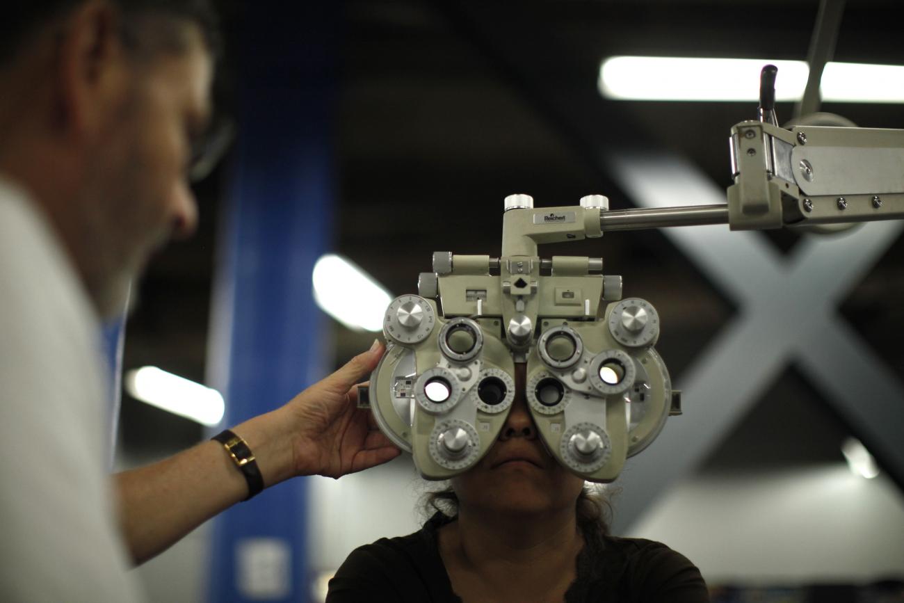 A woman receives an eye exam at the Care Harbor/LA free clinic in Los Angeles, California on September 27, 2012.