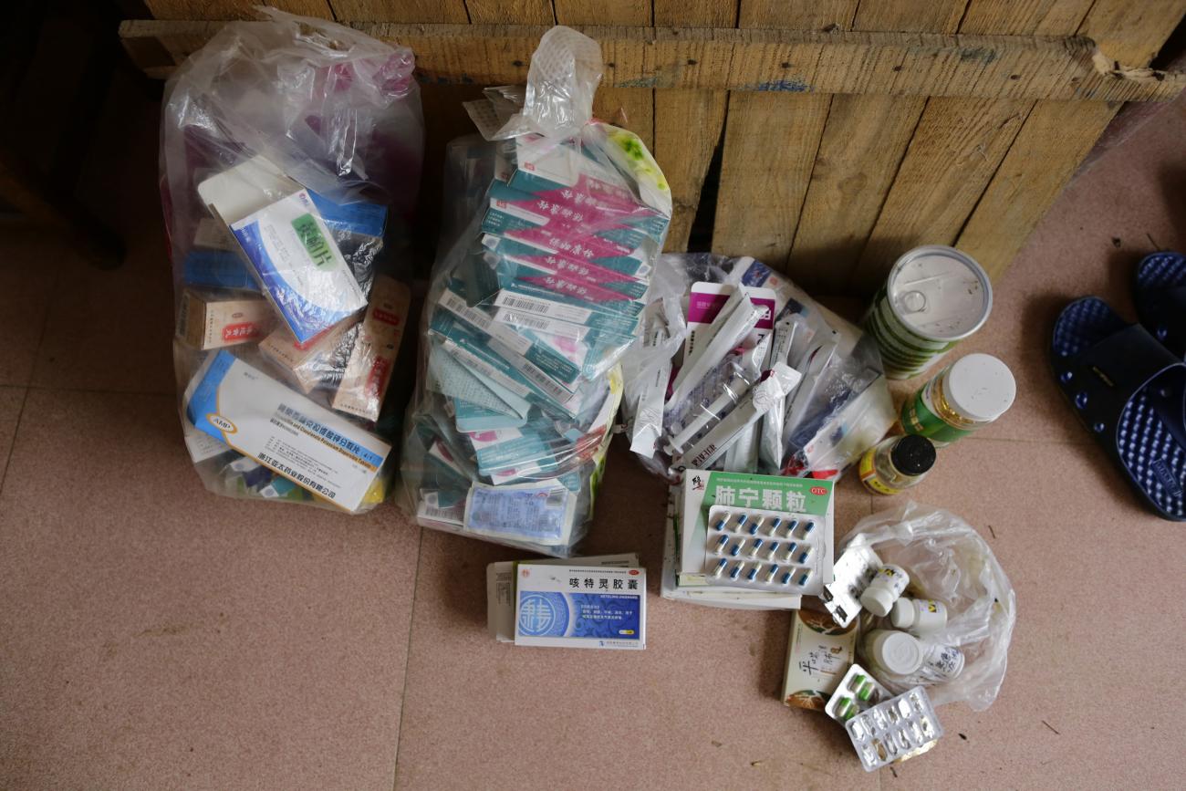 Medicines used to treat lung cancer are gathered on a patient's floor in Shimen county, Hunan Province, China on June 3, 2014