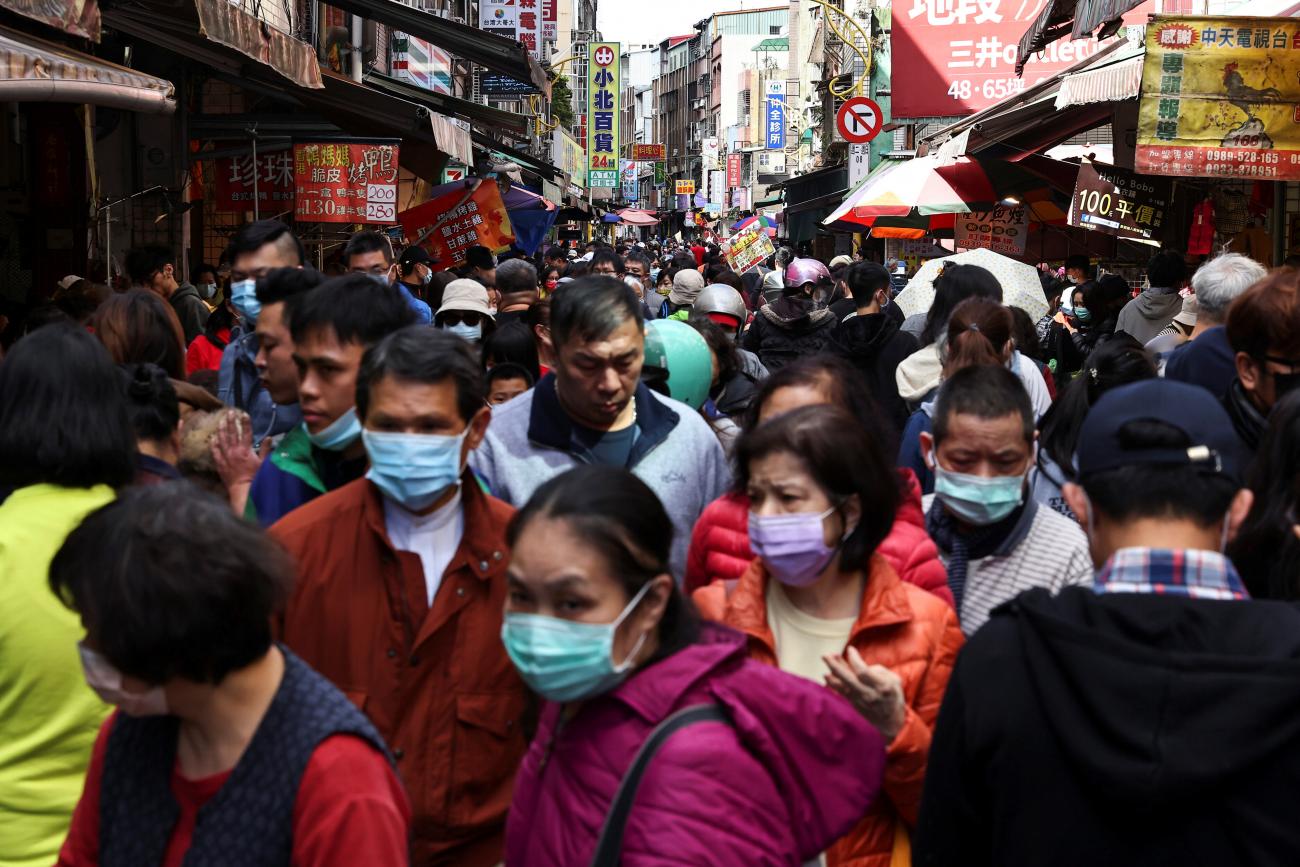 People shop while wearing a protective masks to prevent the spread of coronavirus disease (COVID-19) ahead of the Lunar New Year holiday in Taipei, Taiwan on February 10, 2021.