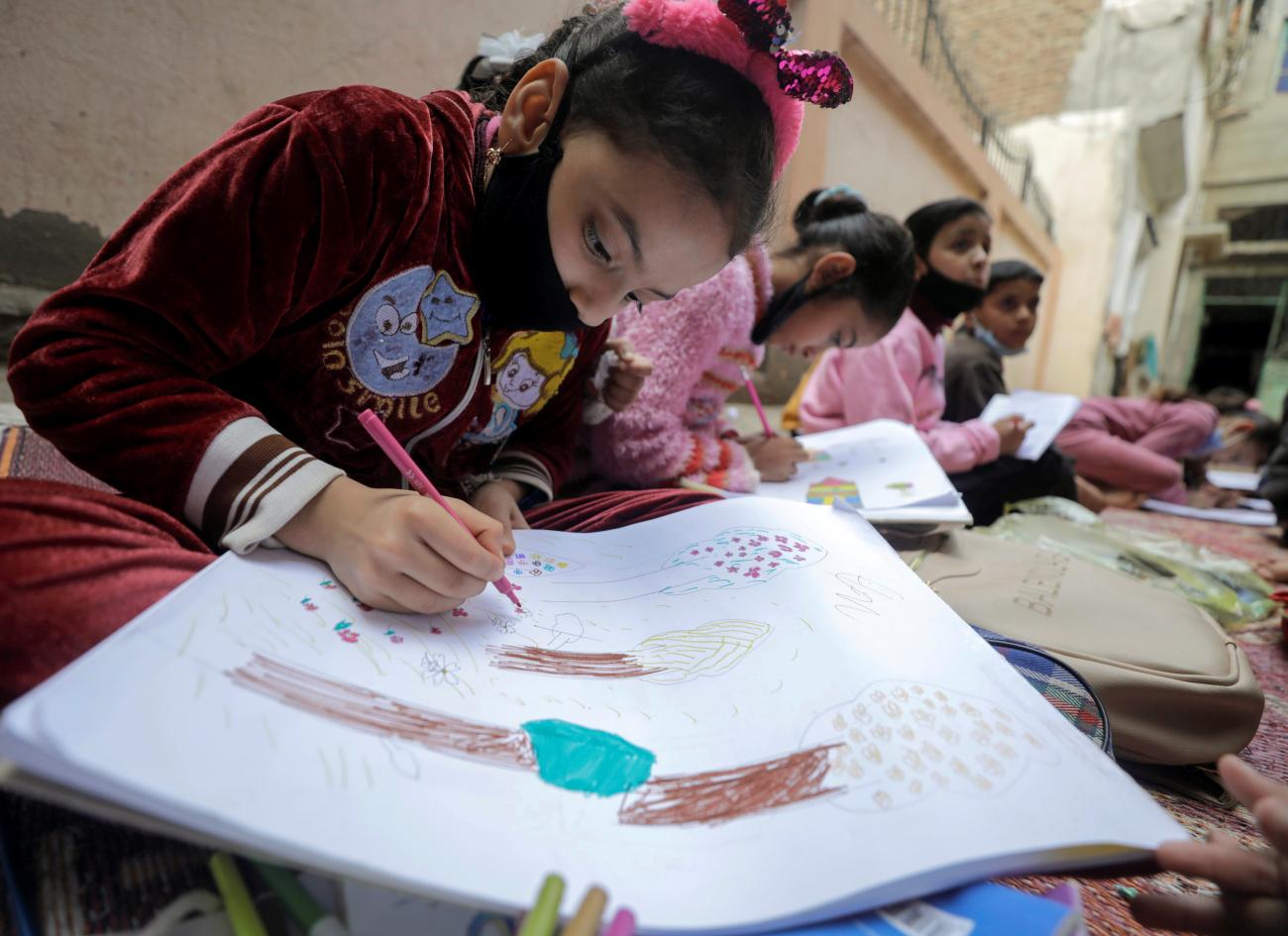 A girl attends class in Dakahlia province, Egypt on February 7, 2021.