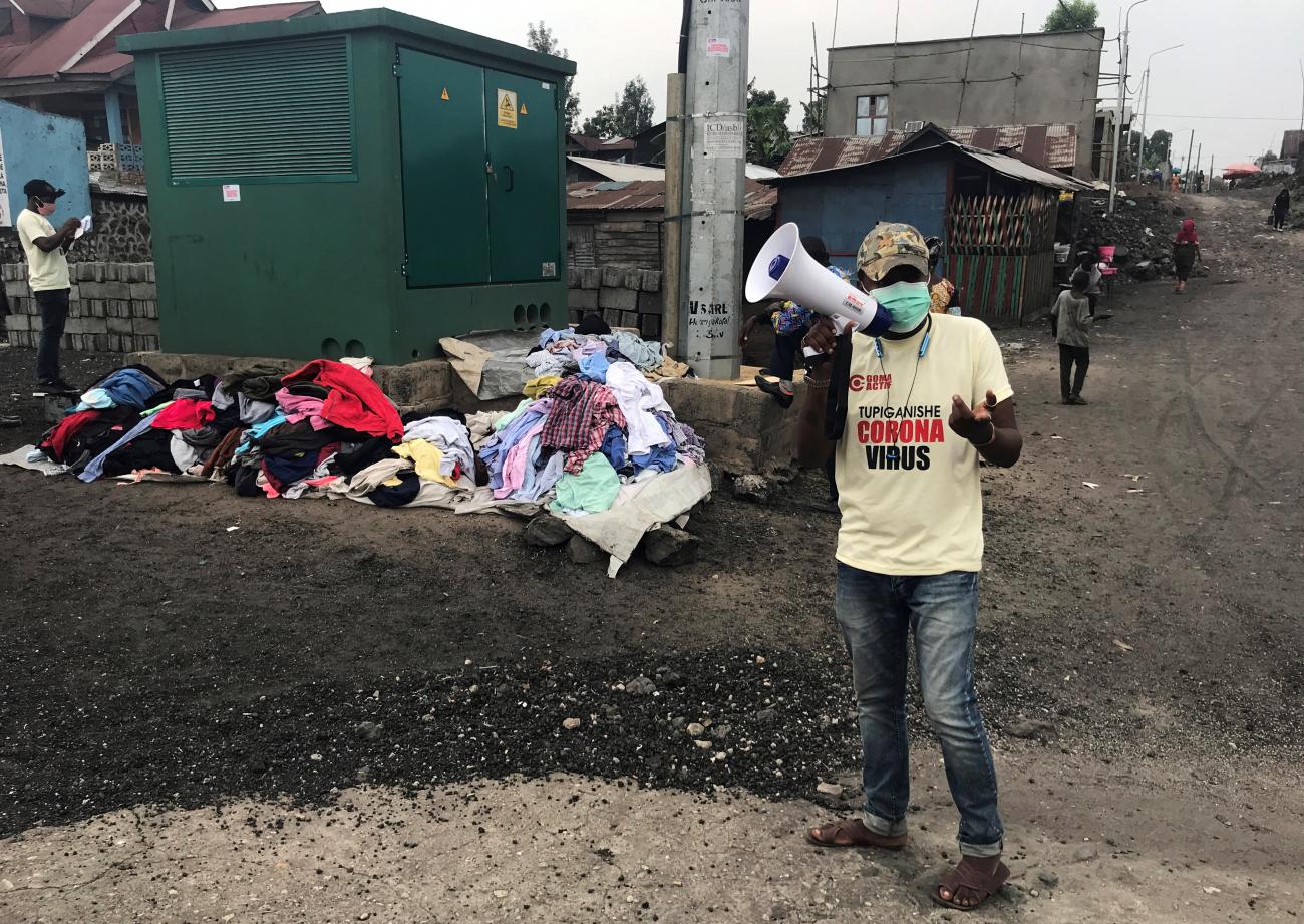 A volunteer of Goma Actif sensitizes the population on the advocacy measures to prevent against the spread of the coronavirus disease (COVID-19) within Ndosho quarters in Goma, eastern Democratic Republic of Congo August 29, 2020.