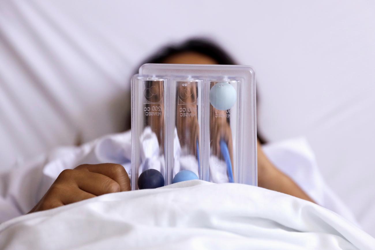 A woman infected with the coronavirus disease (COVID-19) uses a spirometer device to increase lung capacity at the maternity ward for mothers infected with the coronavirus, at the Maternal Perinatal Hospital 'Monica Pretelini Saenz', in Toluca, Mexico February 4, 2021.