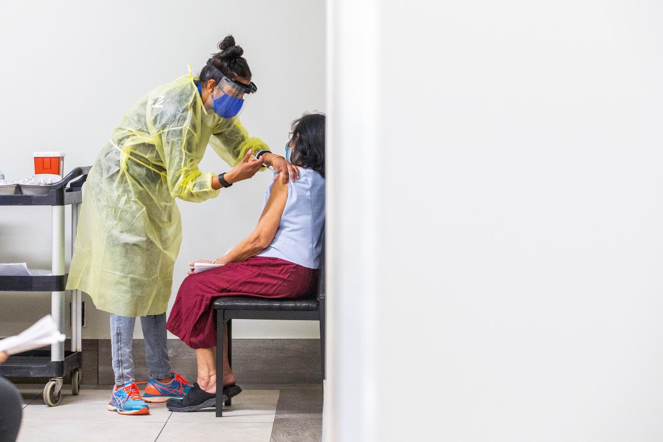 Doctor Meera Jayarajan from Humber River Hospital administer the Moderna coronavirus disease (COVID-19) vaccine to a resident at a Toronto Community Housing seniors building in the northwest end of Toronto, Ontario, Canada March 25, 2021.