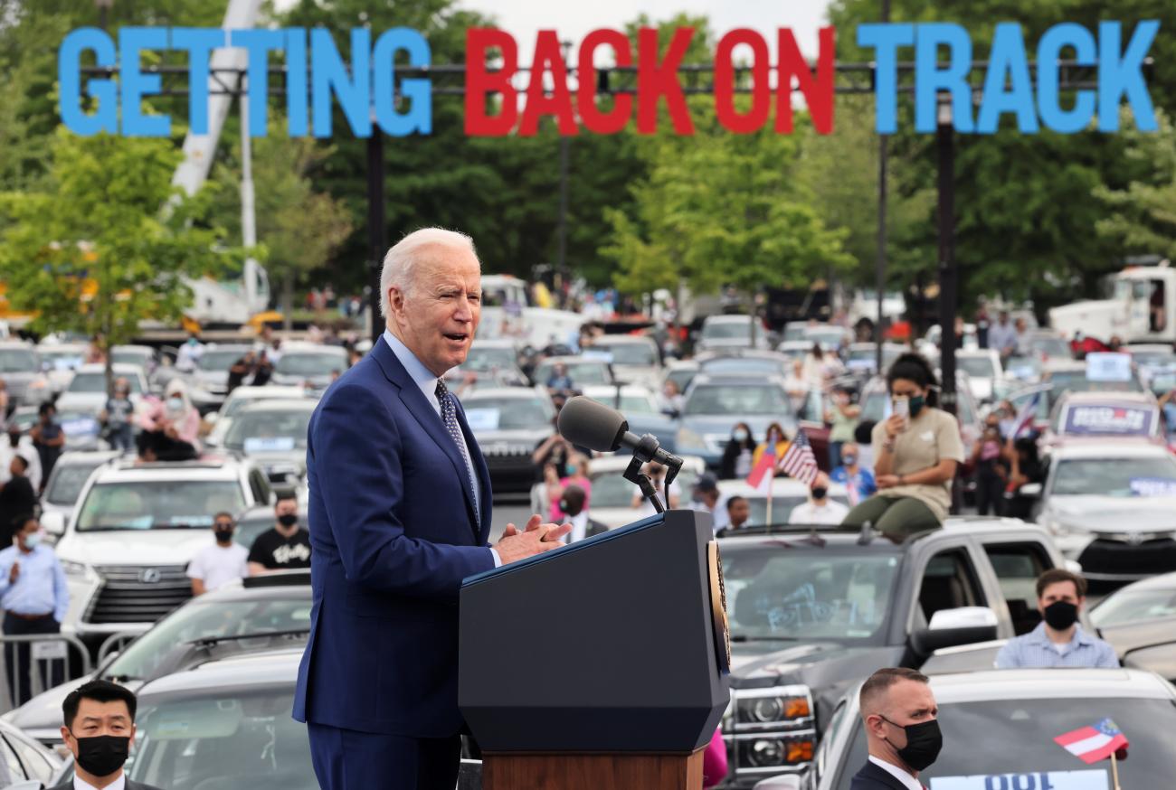 U.S. President Joe Biden speaks during the Democratic National Committee's "Back on Track" drive-in car rally to celebrate the president's 100th day in office at the Infinite Energy Center in Duluth, Georgia, U.S., April 29, 2021.