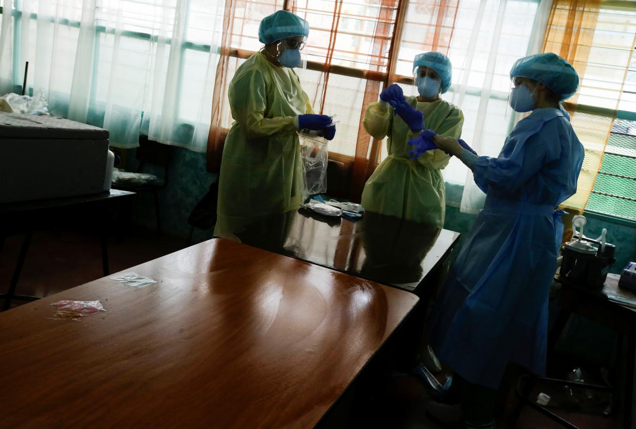 Health care workers prepare to take swab tests for the coronavirus disease in San Jose, Costa Rica on June 26, 2020. REUTERS/Juan Carlos Ulate