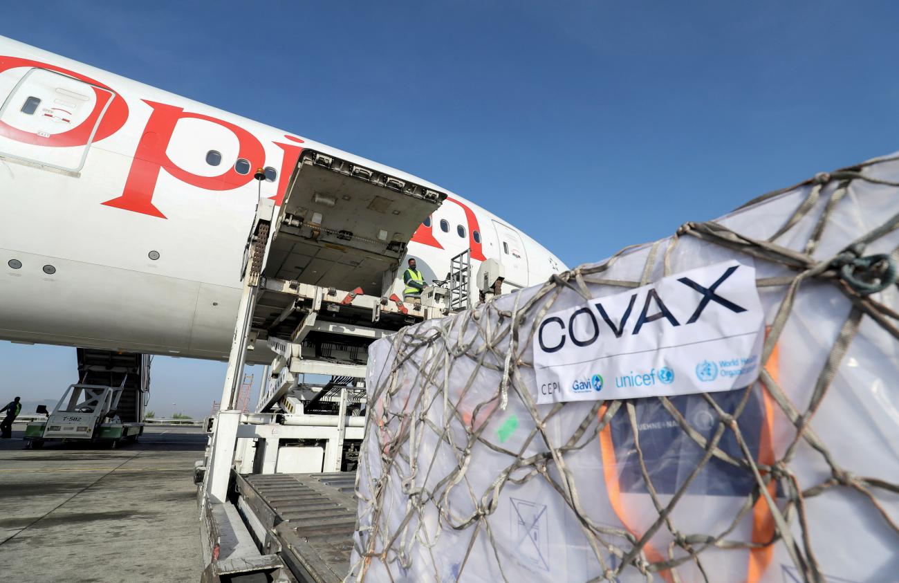 Ethiopian Airlines staff unload COVAX-supplied AstraZeneca/Oxford vaccines from a cargo plane at Bole International Airport in Addis Ababa, Ethiopia on March 7, 2021.