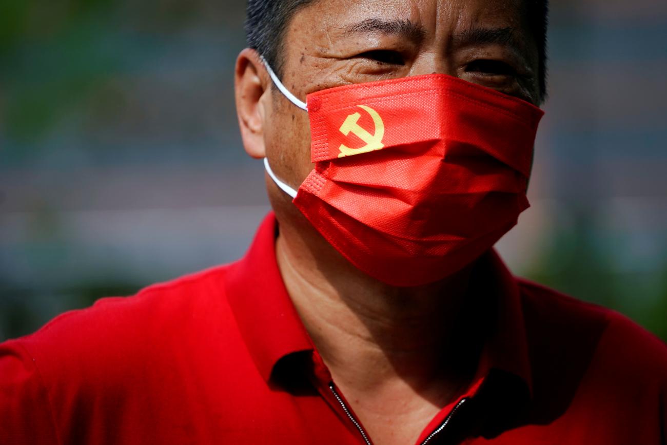 A man, wearing a face mask with the Chinese Communist Party emblem following the coronavirus disease (COVID-19) outbreak, visits the Memorial of the First National Congress of the Communist Party of China on the 100th founding anniversary of the party in Shanghai, China July 1, 2021.