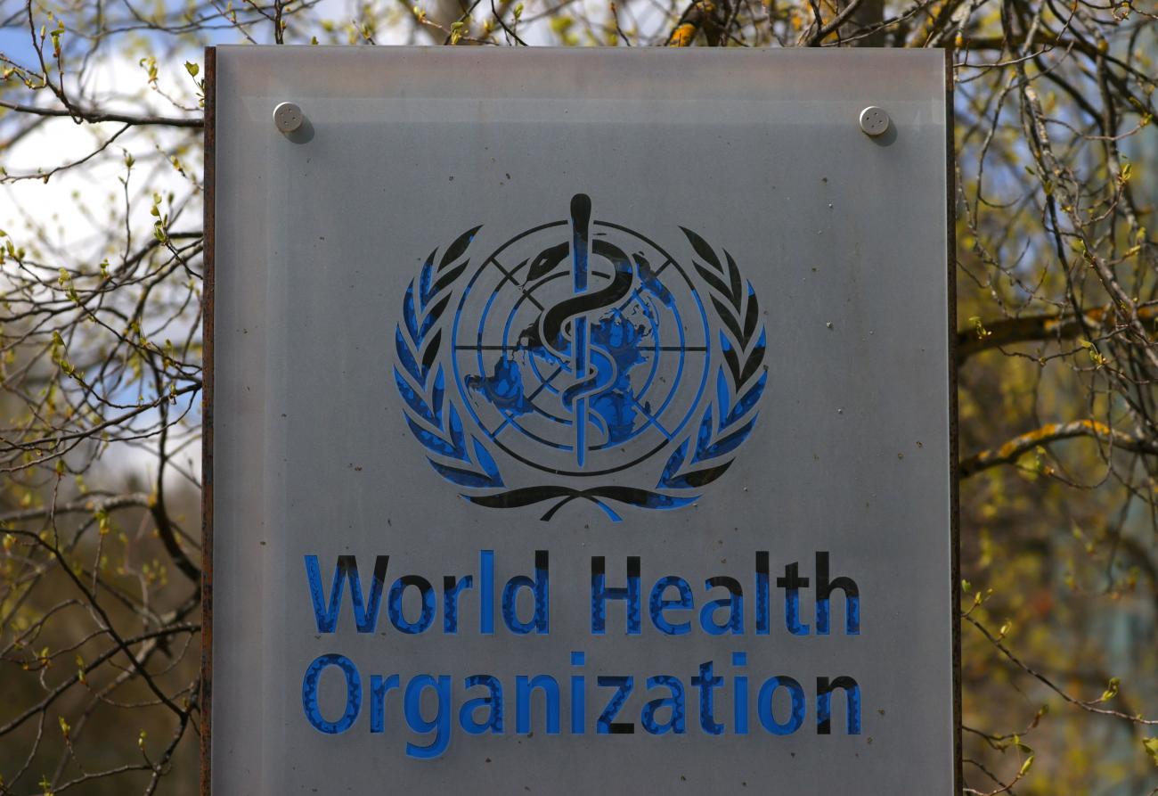 Large sign with a World Health Organization logo during an executive board meeting on the COVID-19 outbreak held in Geneva, Switzerland, April 6, 2021.