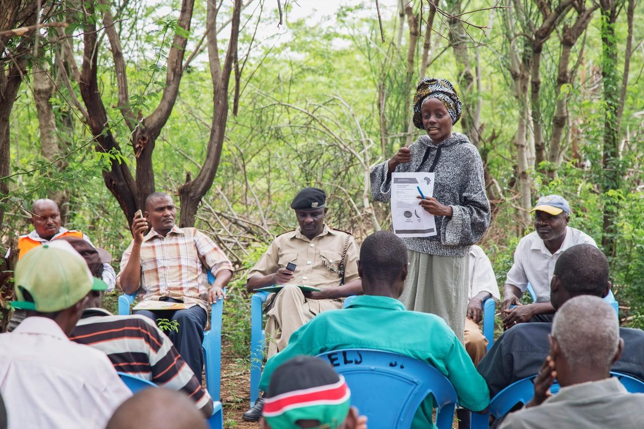 Lea Kilenga Masamo educates a group of people as part of an outreach effort for sickle cell disease. 