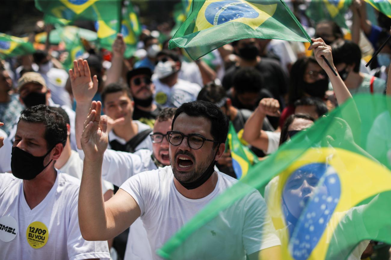 People march and wave flags of Brazil during a protest to demand the impeachment of Brazil's President Jair Bolsonaro, opposing his handling of the coronavirus disease pandemic. Photo taken at Paulista Avenue in Sao Paulo, Brazil, on September 12, 2021.