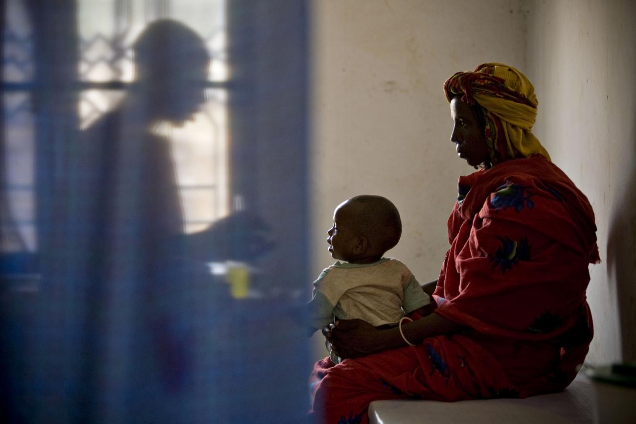 A doctor administers medicine to a sick child with his mother at a health clinic run by the medical charity Médecins Sans Frontières Holland in Kerfi, Chad, a site for displaced Chadians, on June 10, 2008. 