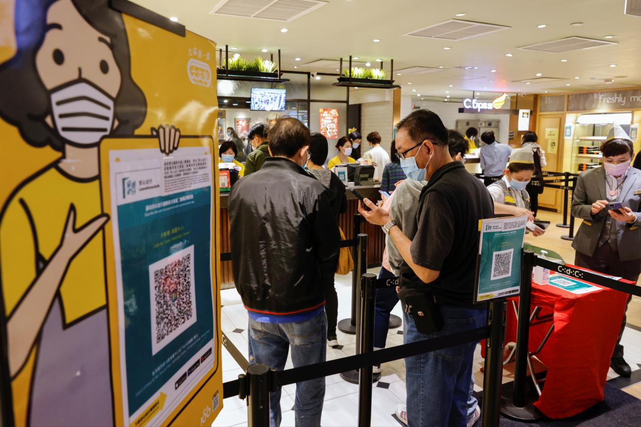 A restaurant posts QR codes for the "LeaveHomeSafe" COVID contact-tracing app following the coronavirus disease outbreak, in Hong Kong, on February 18, 2021.