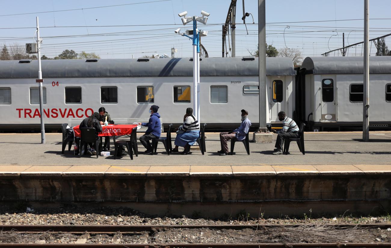 People in line at Springs station, waiting to register for a COVID vaccine after South Africa's Transnet rail company turned a train into a vaccination center to help speed up rollout in remote communities. East Rand, South Africa, on August 30, 2021.