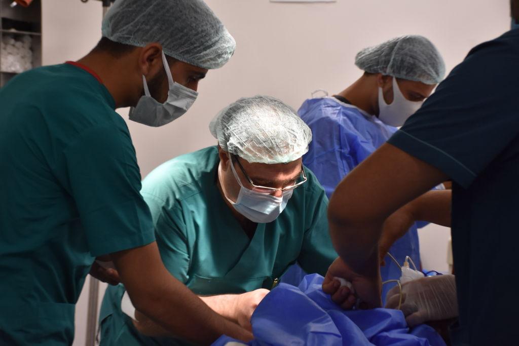 Turkish doctors perform surgery alongside Syrian doctors in Azaz district, Aleppo, Syria, on June 18, 2021.